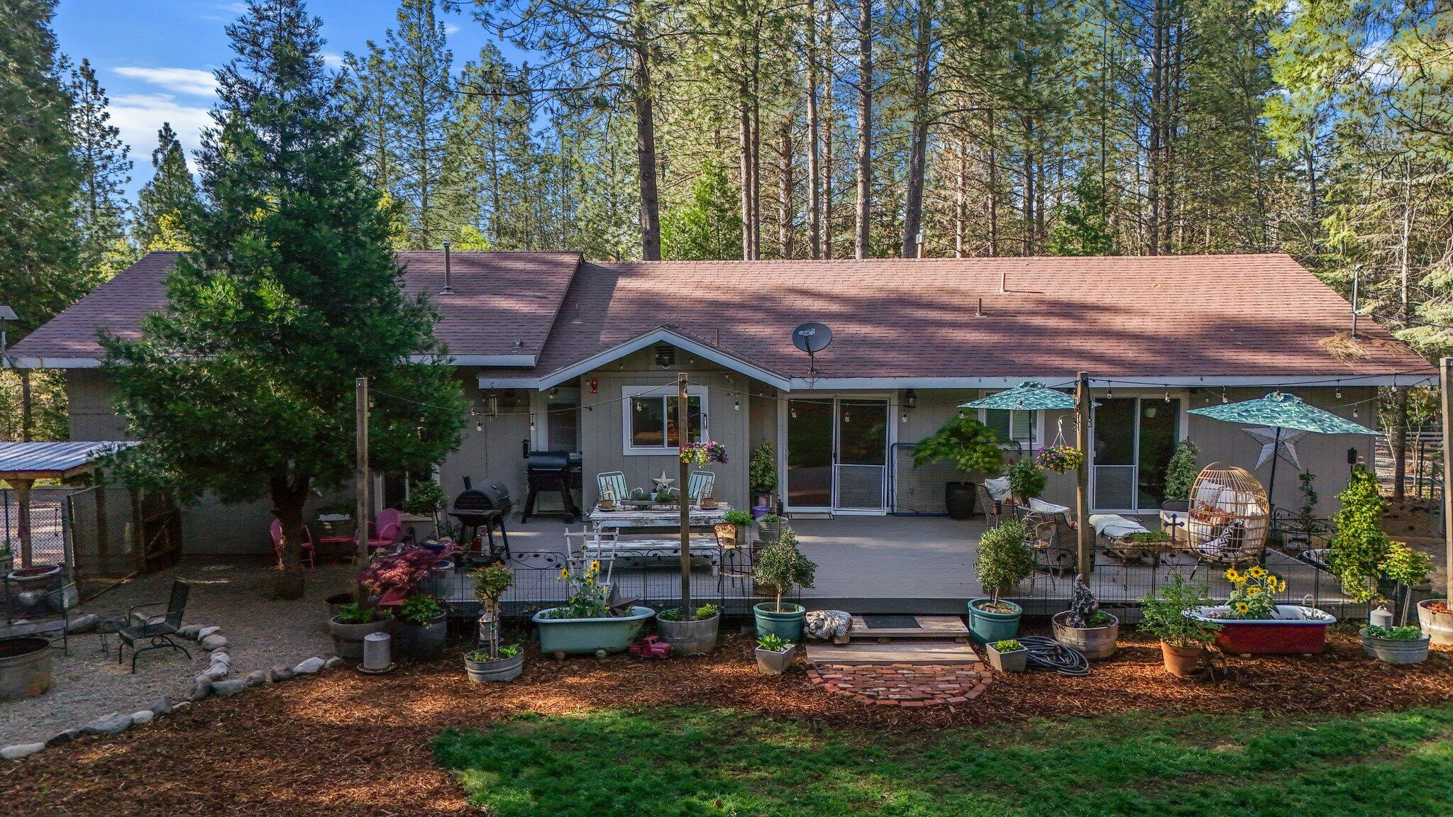 30726 Shingletown Ridge Road Shingletown, CA 96088 - Photo 2 of 84 a view of patio with a table and chairs under an umbrella