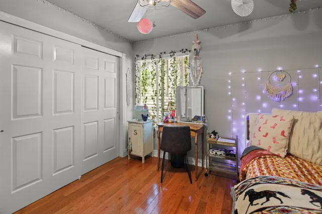 a bedroom with furniture and a chandelier