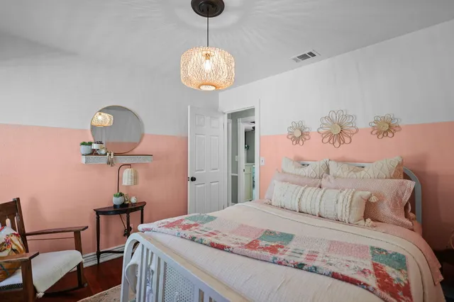 a view of a field with trees in the background