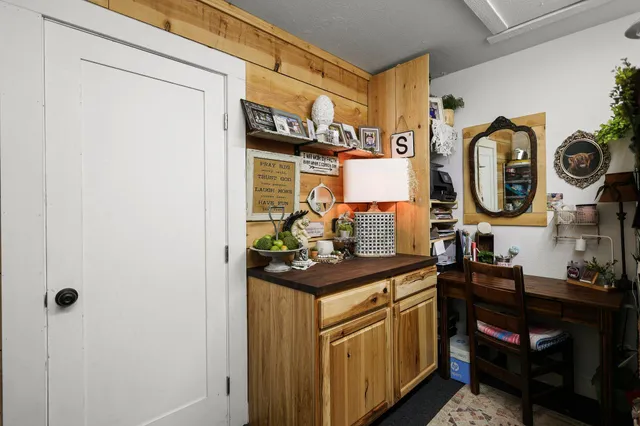 a view of a bench in a backyard of a house