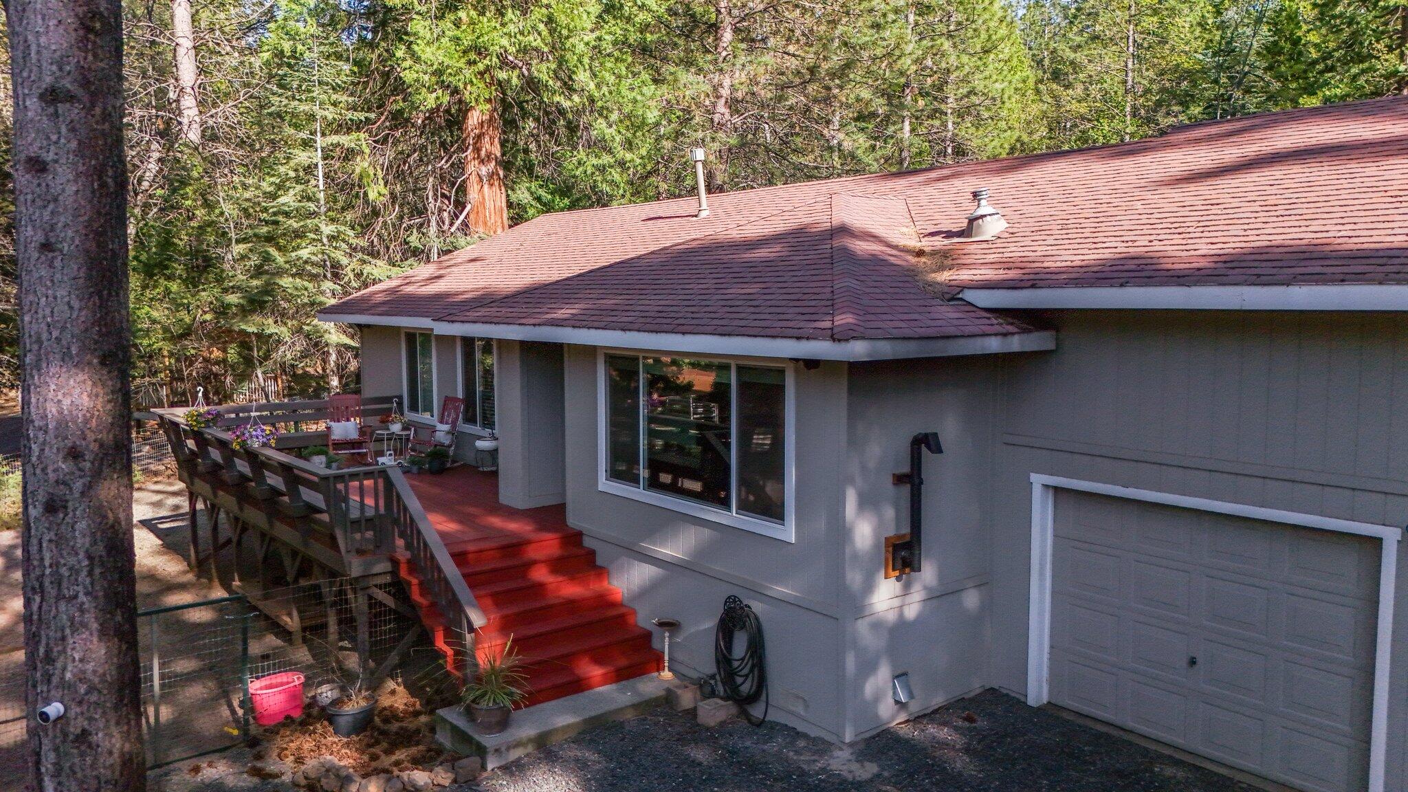 30726 Shingletown Ridge Road Shingletown, CA 96088 - Photo 5 of 84 a view of a house with a patio and a fire pit