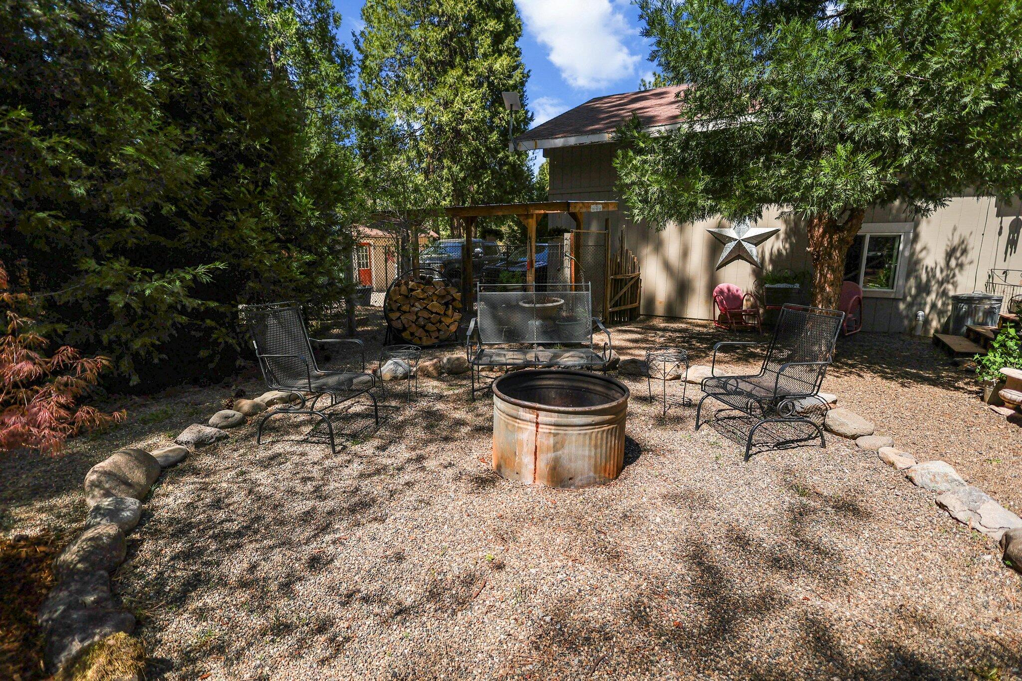 30726 Shingletown Ridge Road Shingletown, CA 96088 - Photo 57 of 84 a view of a patio with table and chairs and potted plants