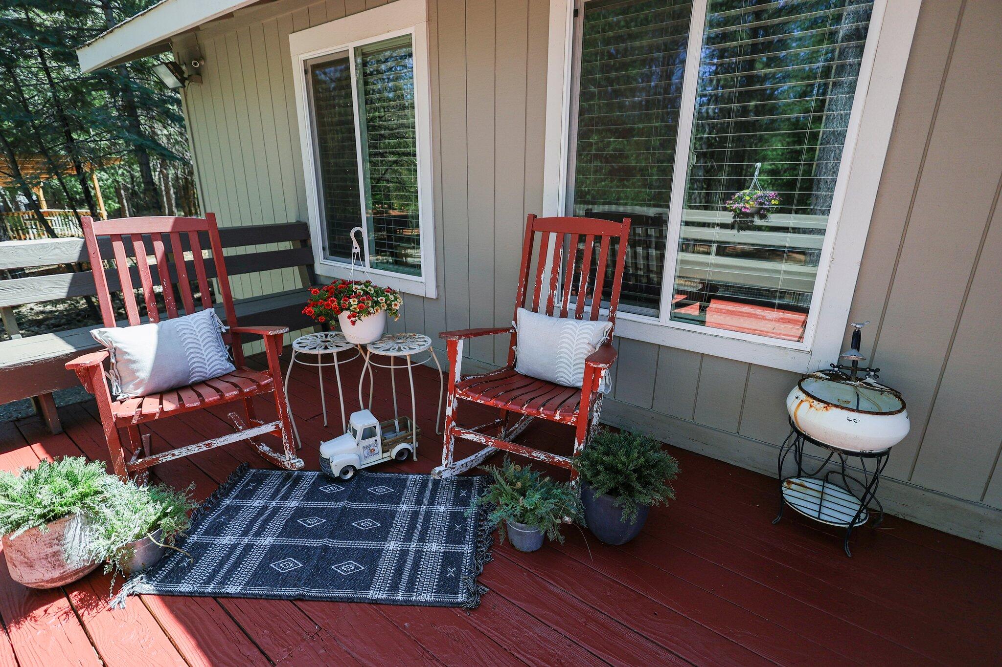 30726 Shingletown Ridge Road Shingletown, CA 96088 - Photo 8 of 84 a view of a deck with couches table and chairs and potted plants