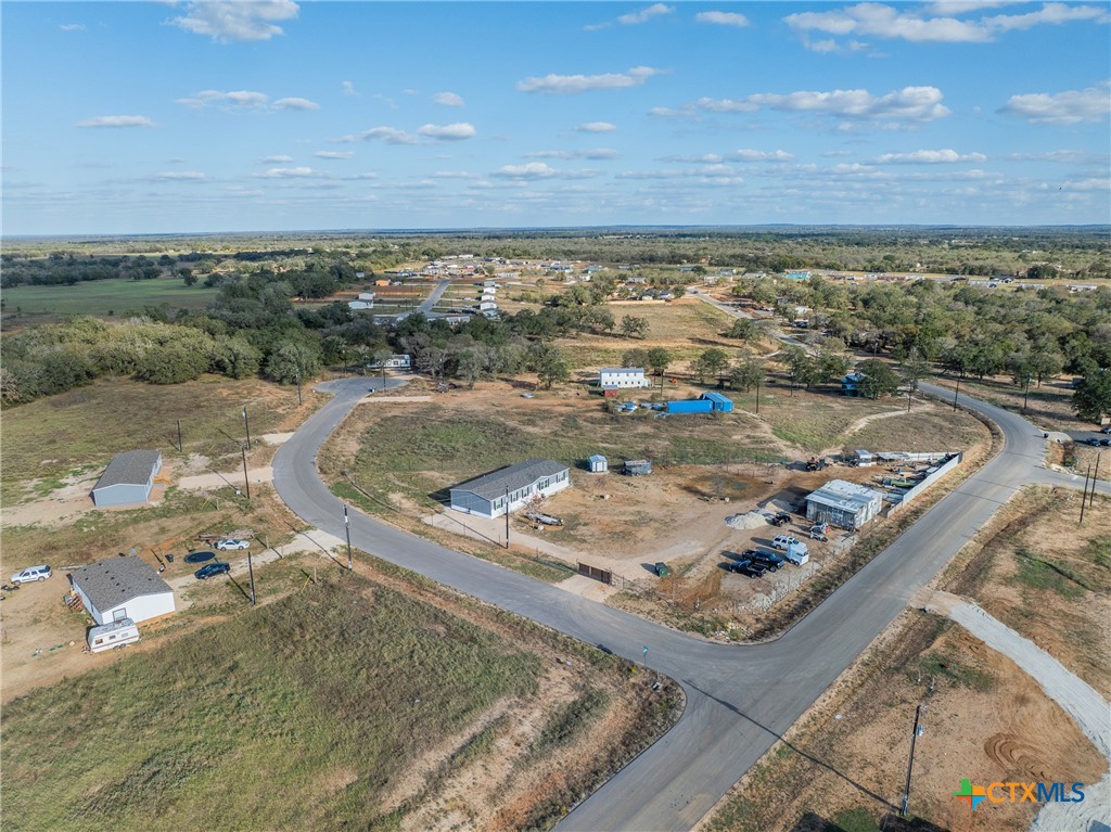 150 Azalea Ct Dale Dale, TX 78616 - Photo 9 of 11 an aerial view of residential houses with outdoor space