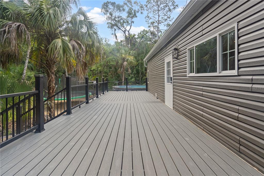 375 Sapp Street Inglis, FL 34449 - Photo 29 of 36 a view of backyard with a deck and wooden floor