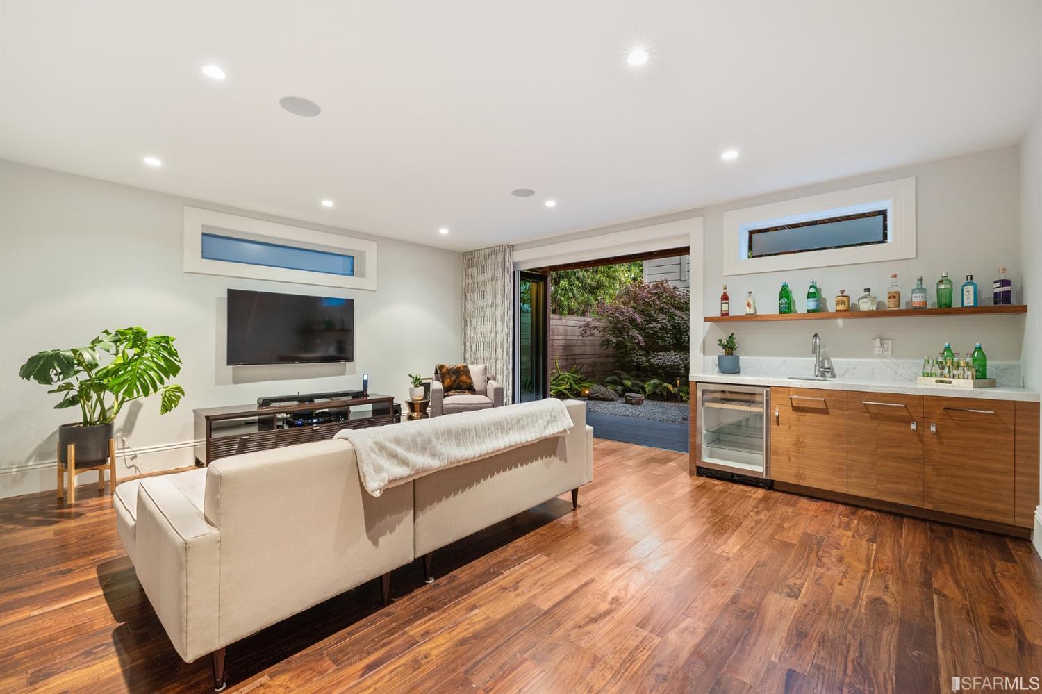 Clay Street San Francisco, CA 94115 - Photo 83 of 90 Lower level family room has lots of room for all of your activities. Nana door opens fully to integrate the back yard. Peloton anyone?