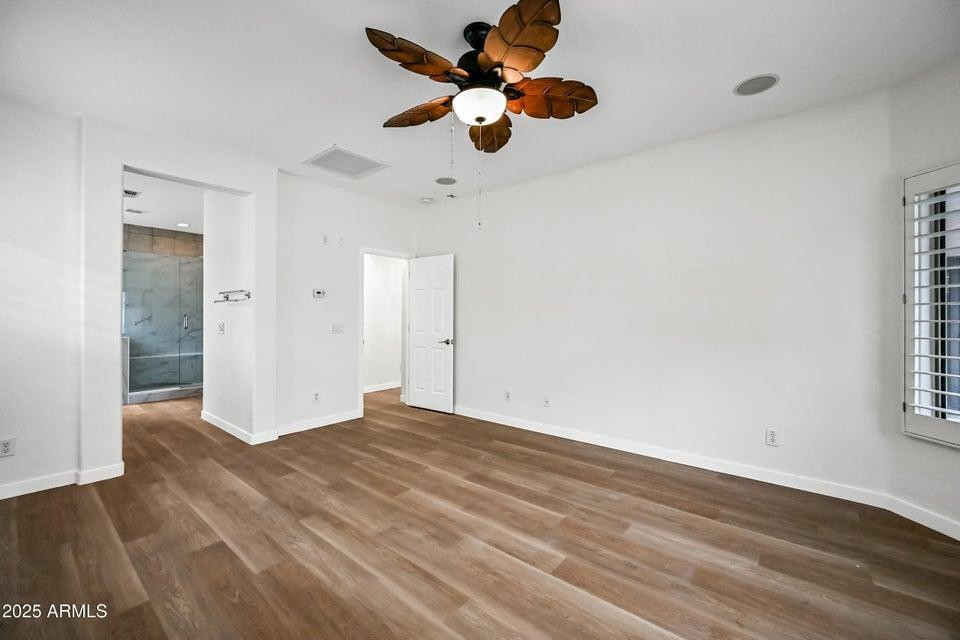 865 South Oak Street Gilbert, AZ 85233 - Photo 14 of 27 a view of an empty room with window and wooden floor