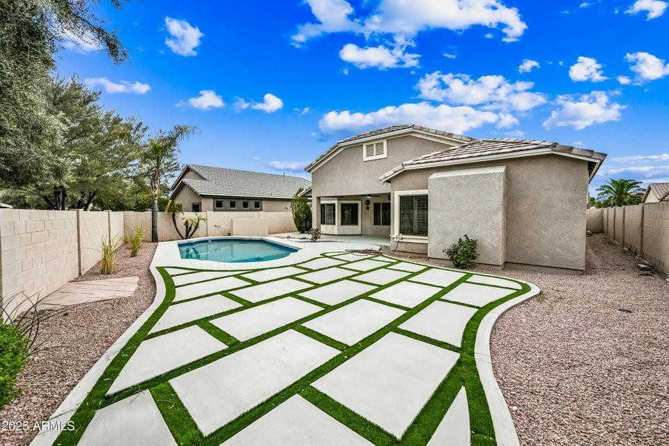 865 South Oak Street Gilbert, AZ 85233 - Photo 26 of 27 a patio with a table and chairs and a barbeque