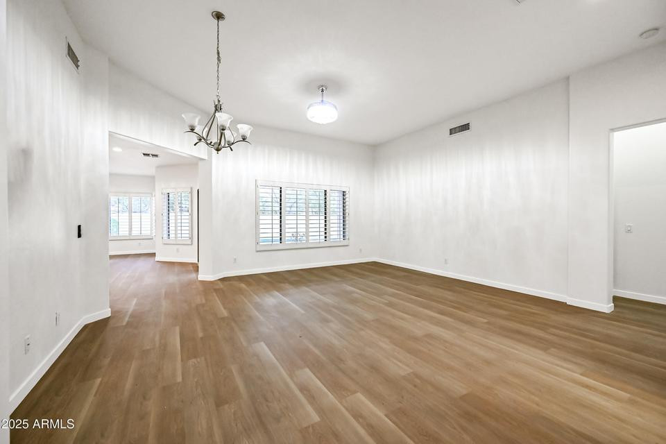 865 South Oak Street Gilbert, AZ 85233 - Photo 3 of 27 a view of an empty room with wooden floor and window