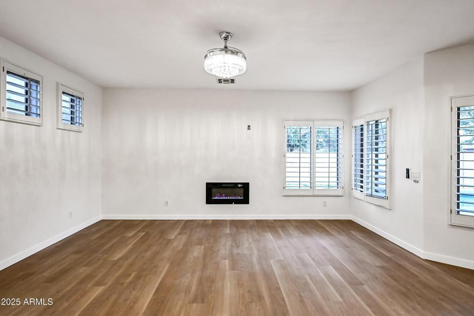 865 South Oak Street Gilbert, AZ 85233 - Photo 6 of 27 wooden floor in an empty room with a window
