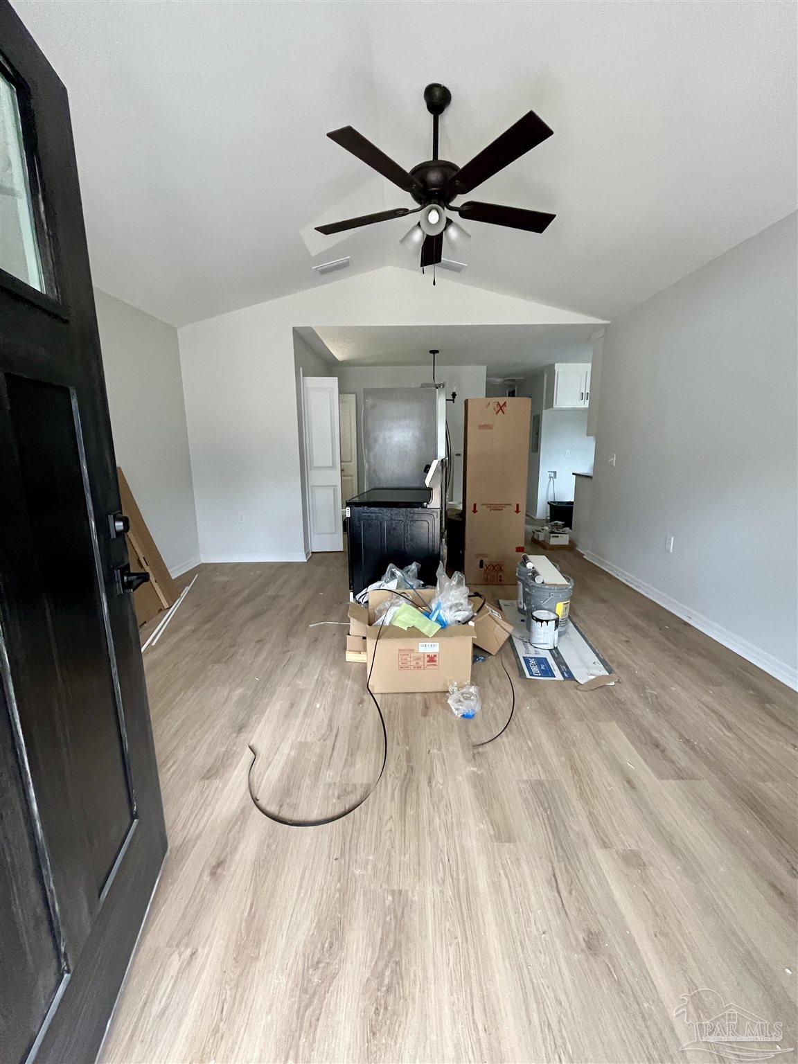 5634 Alabama Street Milton, FL 32570 - Photo 3 of 9 a view of a livingroom with furniture nad wooden floor