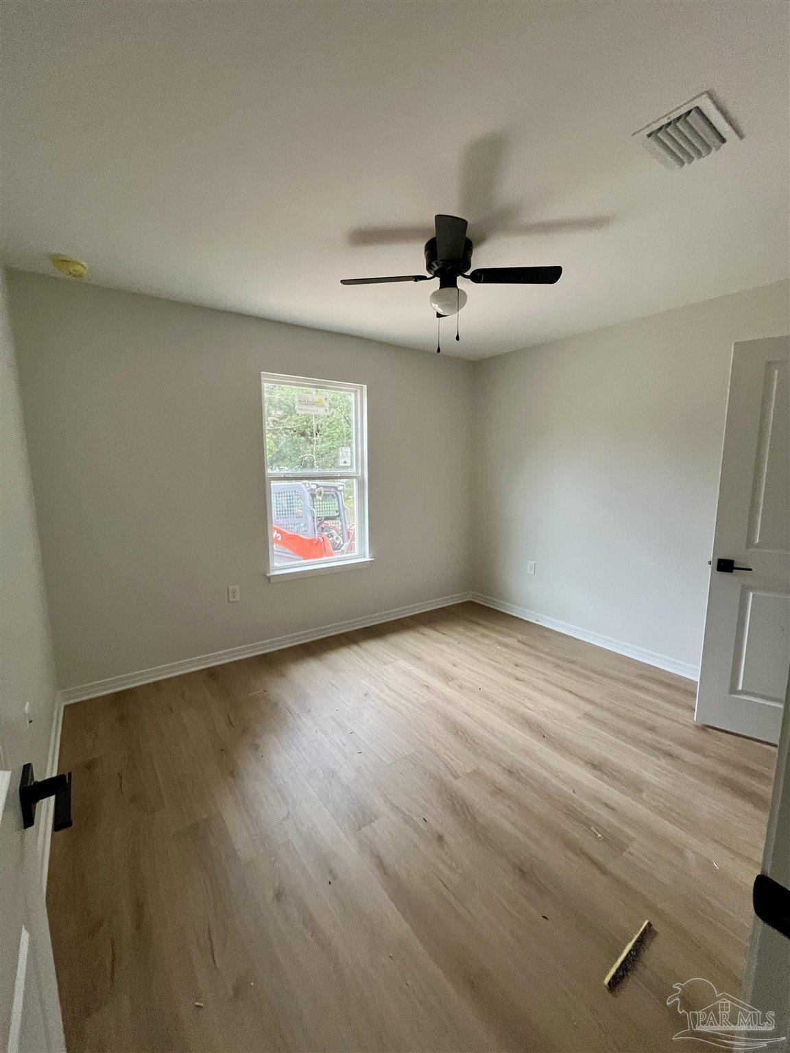 5634 Alabama Street Milton, FL 32570 - Photo 8 of 9 a view of an empty room with a window