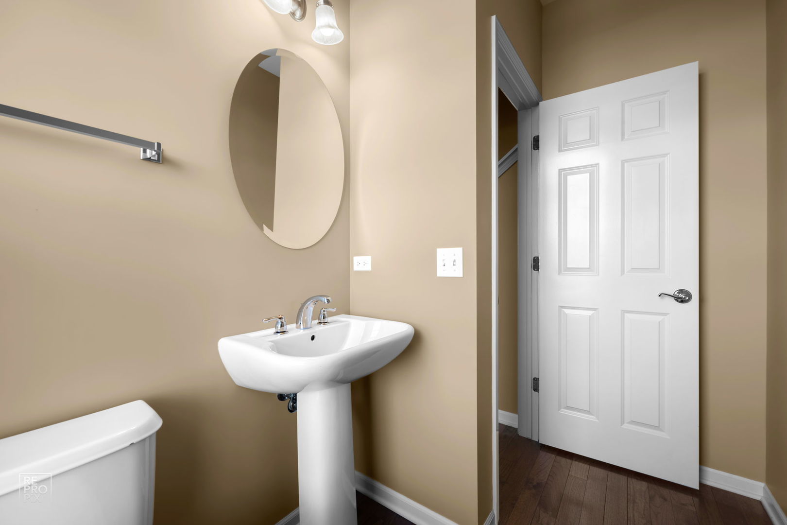 259 Aspen Pointe Road, Unit B Vernon Hills, IL 60061 - Photo 7 of 13 a bathroom with a sink a mirror and a toilet