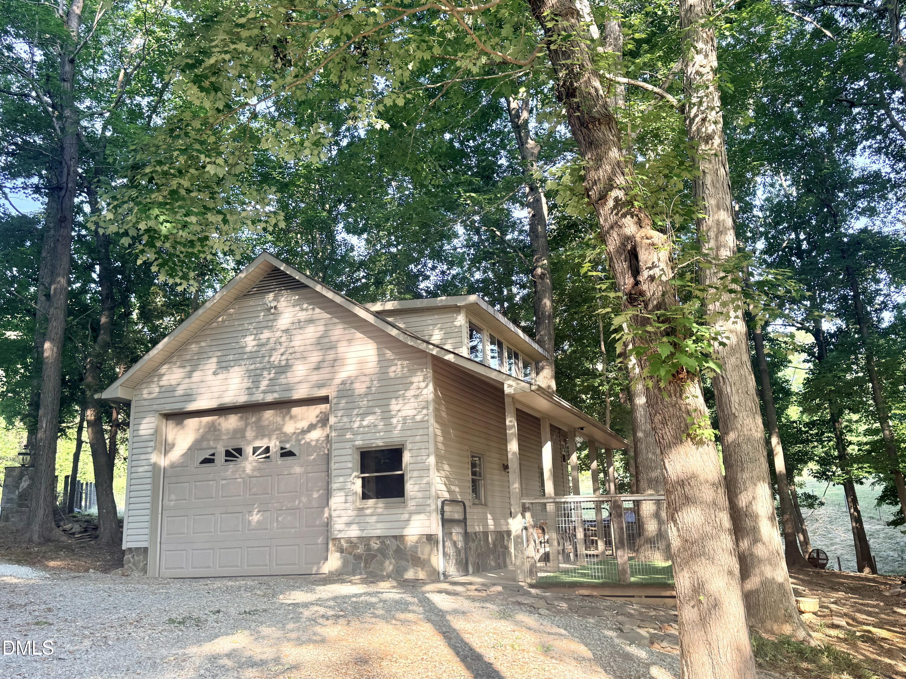 81 Beaver Crossing Road Roxboro, NC 27574 - Photo 5 of 80 a view of a white house with a large tree and a yard
