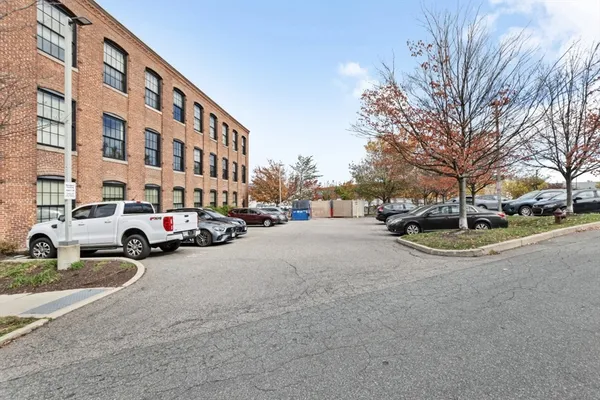 a view of a swimming pool with a patio and a yard