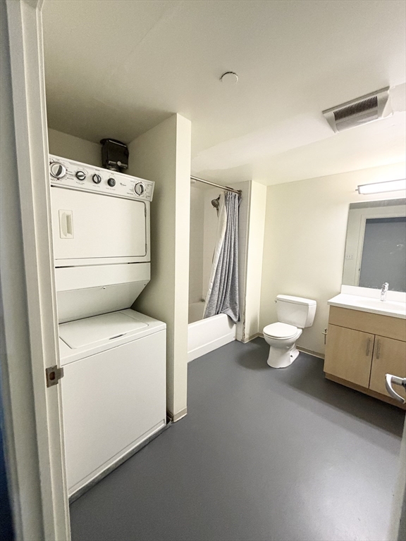 88 Gerrish Avenue, Unit 112 Chelsea, MA 02150 - Photo 4 of 16 a utility room with dryer and washer