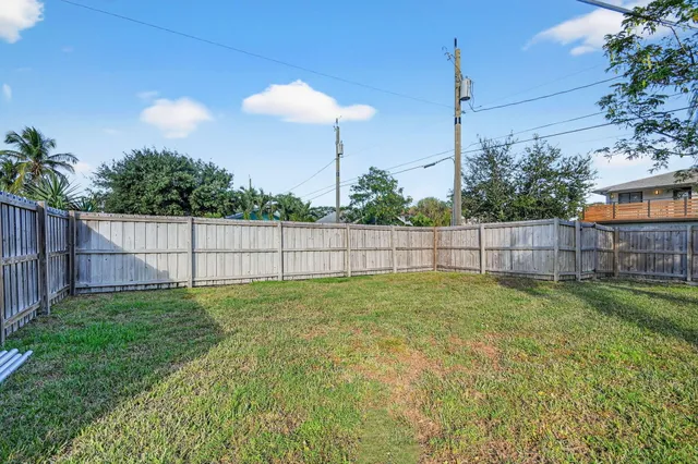 a view of a backyard with green space