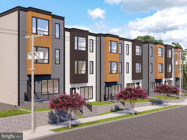a front view of multi story residential apartment building with yard