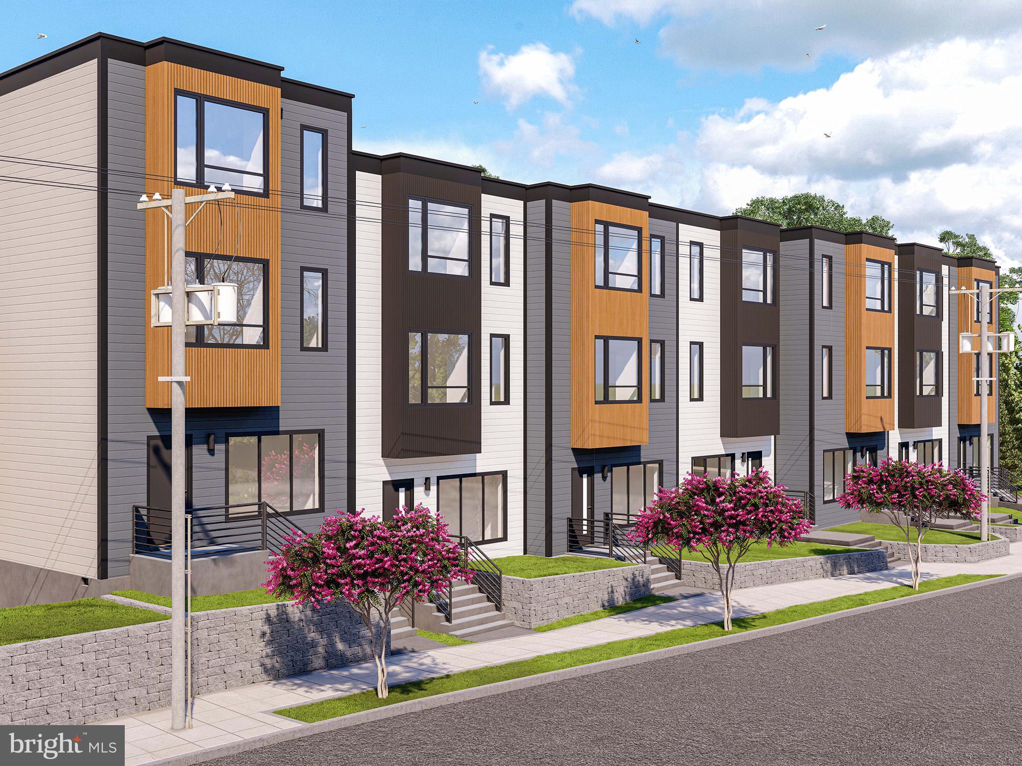 2534 B Elvans Road Southeast Washington, DC 20020 - Photo 2 of 5 a front view of multi story residential apartment building with yard