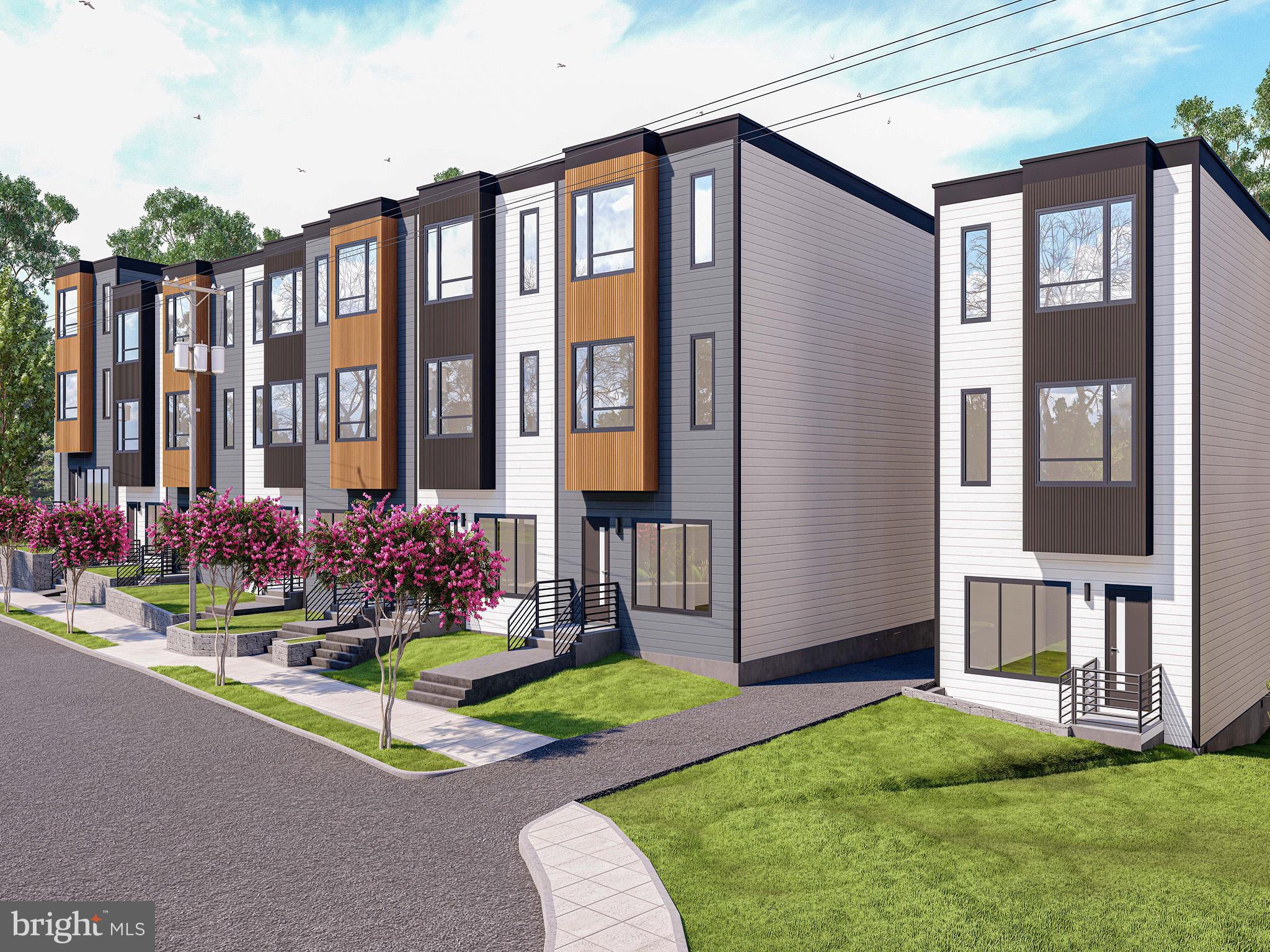 2534 B Elvans Road Southeast Washington, DC 20020 - Photo 3 of 5 a front view of a house having yard