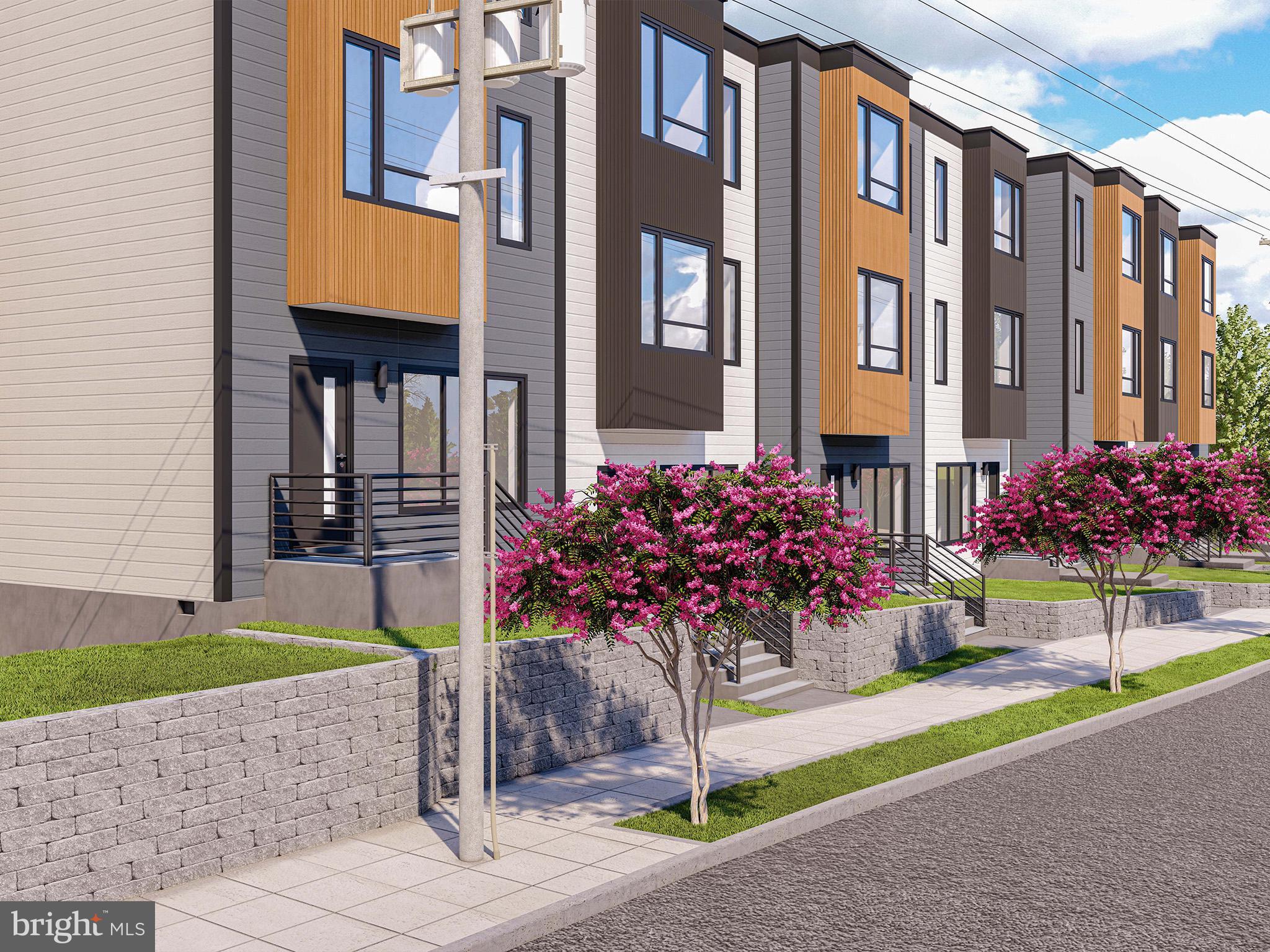 2534 B Elvans Road Southeast Washington, DC 20020 - Photo 4 of 5 a front view of a multi story residential apartment building with a yard