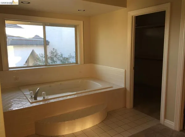 a bath tub sitting next to a window