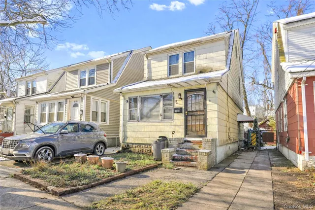 a view of a brick house with many windows