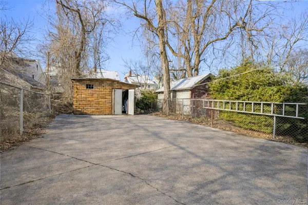 a view of backyard and tree