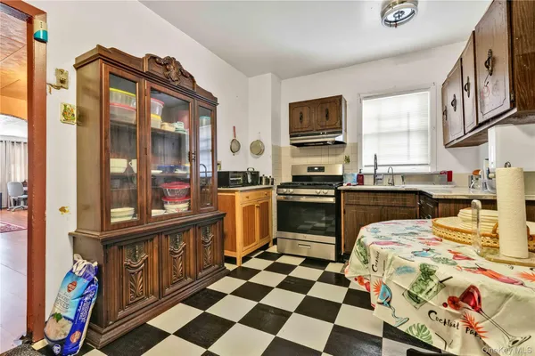 a kitchen with stainless steel appliances and cabinets
