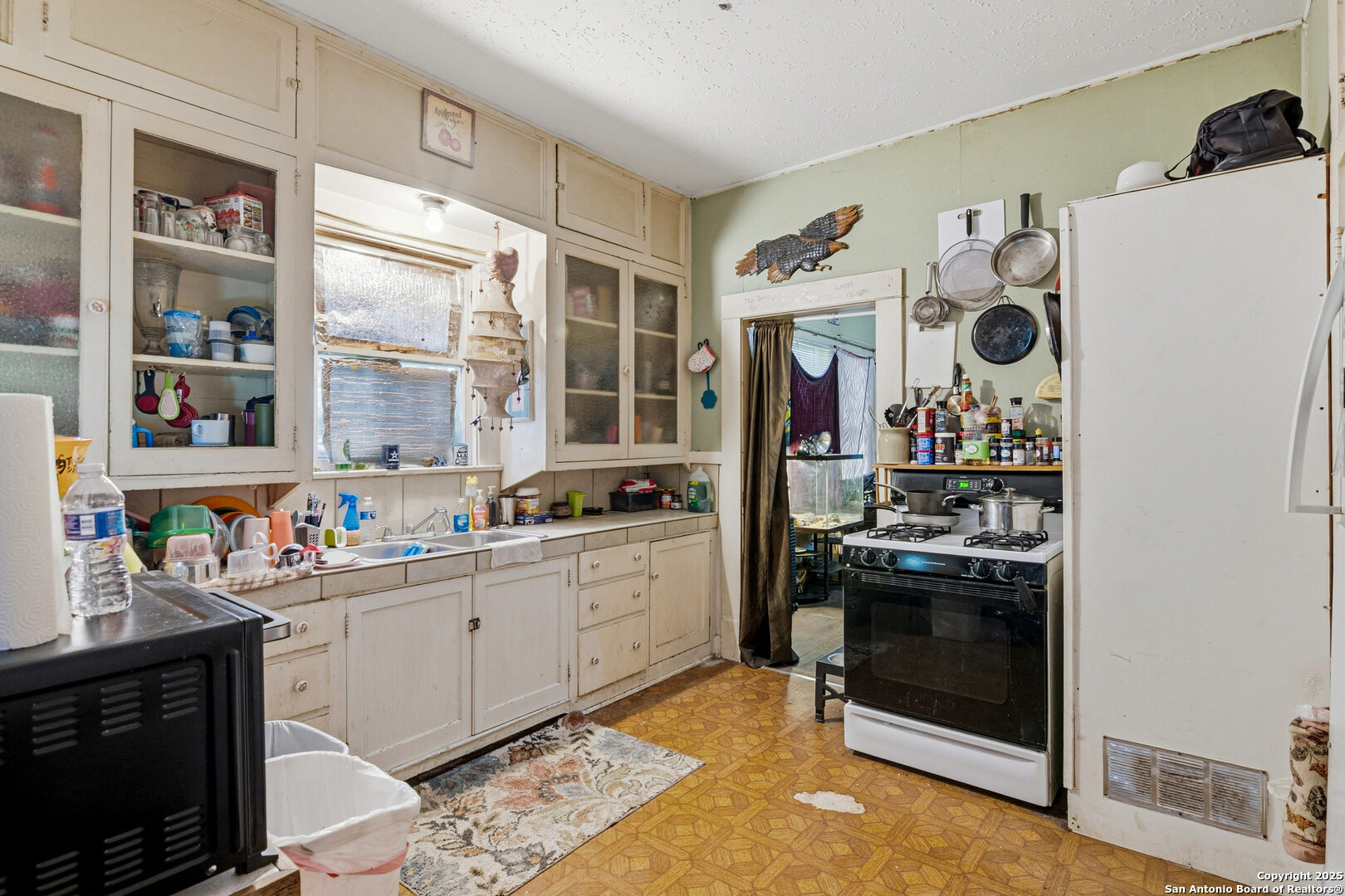 603 East Court Street Seguin, TX 78155 - Photo 14 of 18 a kitchen with stainless steel appliances granite countertop a stove and a sink