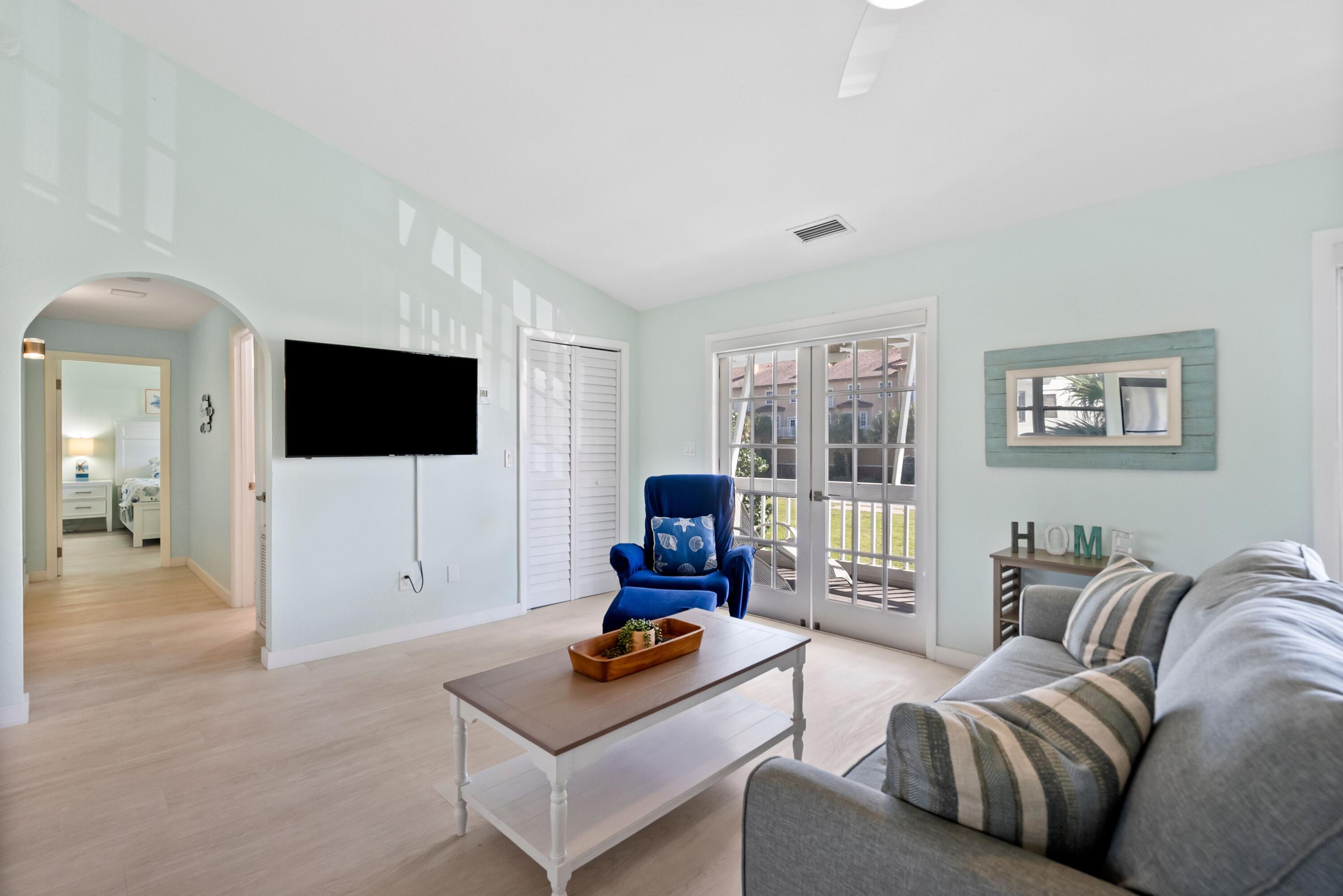 670 Hernando Street, Unit A Fort Pierce, FL 34949 - Photo 1 of 21 a living room with furniture and a flat screen tv