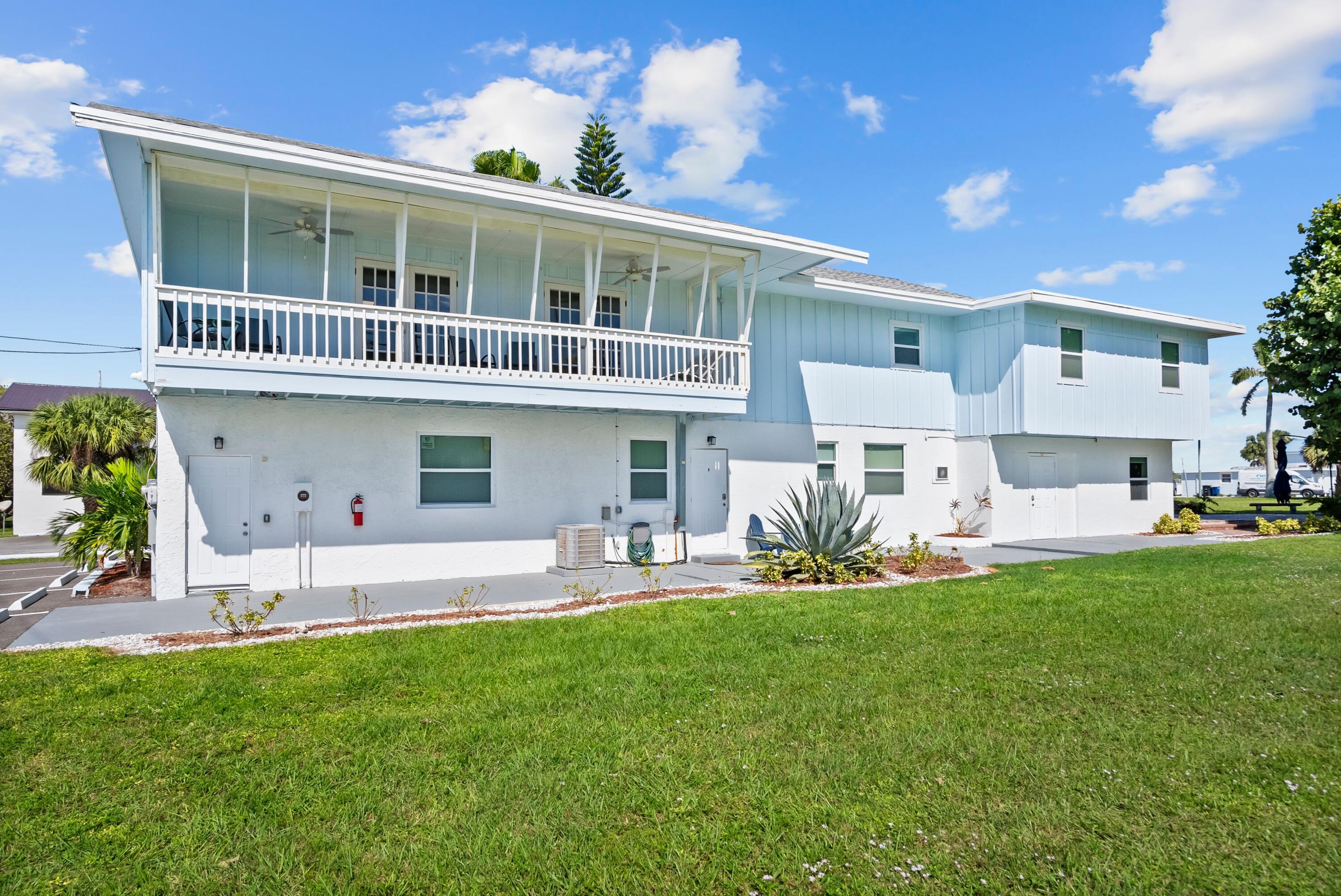 670 Hernando Street, Unit A Fort Pierce, FL 34949 - Photo 12 of 21 a front view of a house with a garden and plants