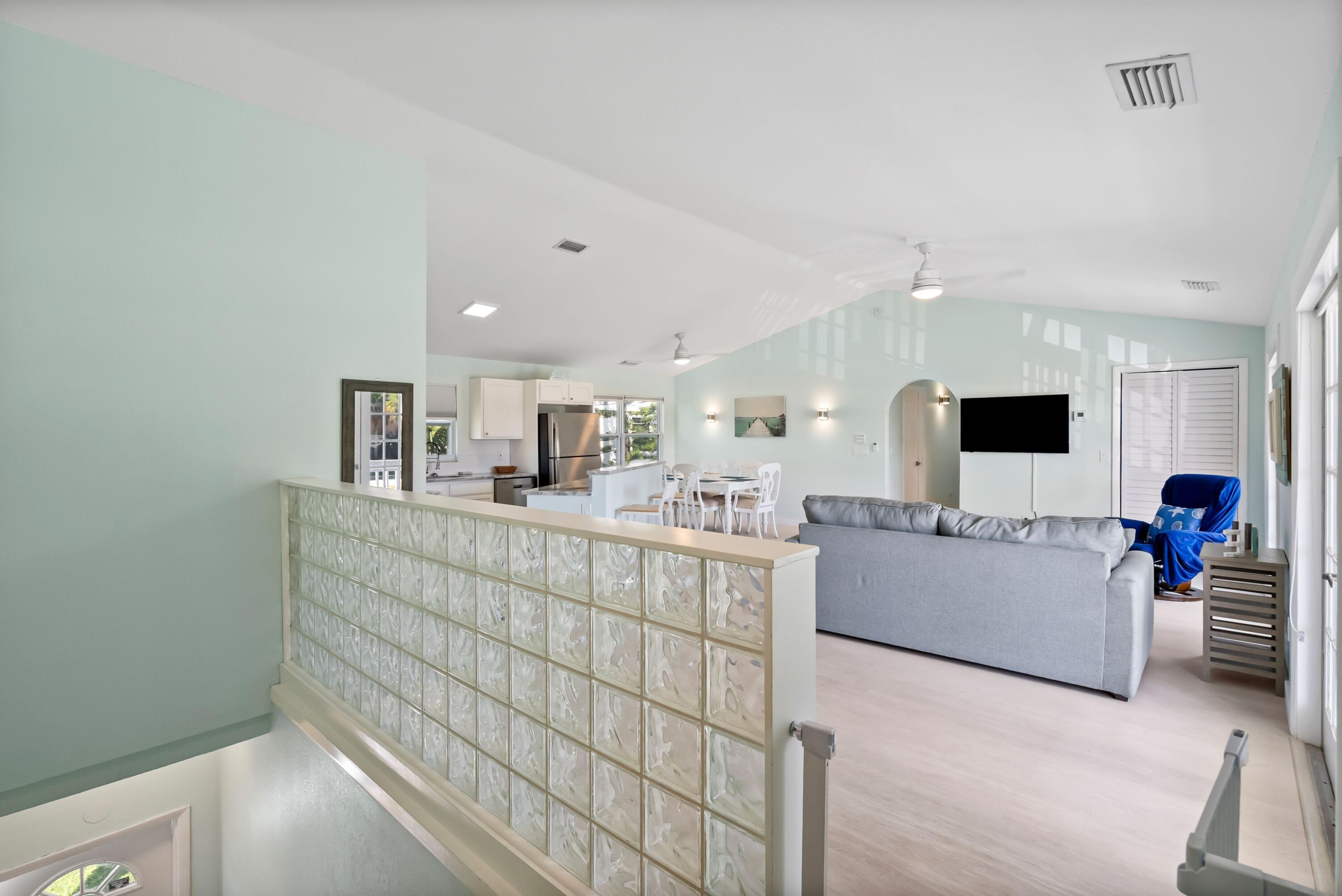 670 Hernando Street, Unit A Fort Pierce, FL 34949 - Photo 2 of 21 a living room with furniture and a flat screen tv
