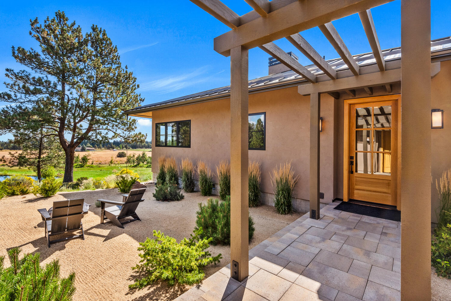 18243 Rock Springs Road Bend, OR 97703 - Photo 4 of 42 04 12 trellis walkway to home