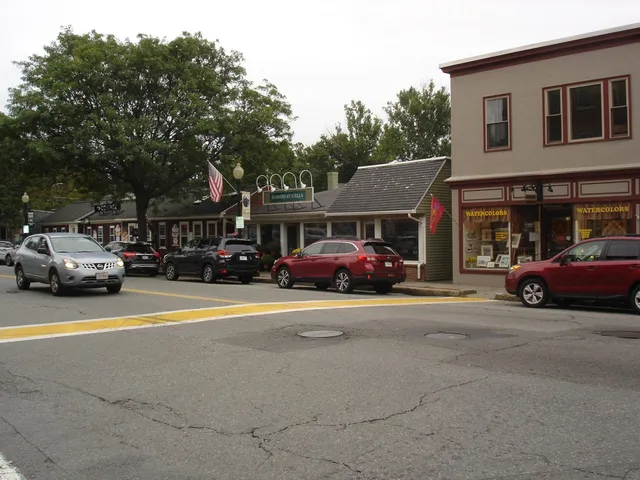 a view of street with parked cars