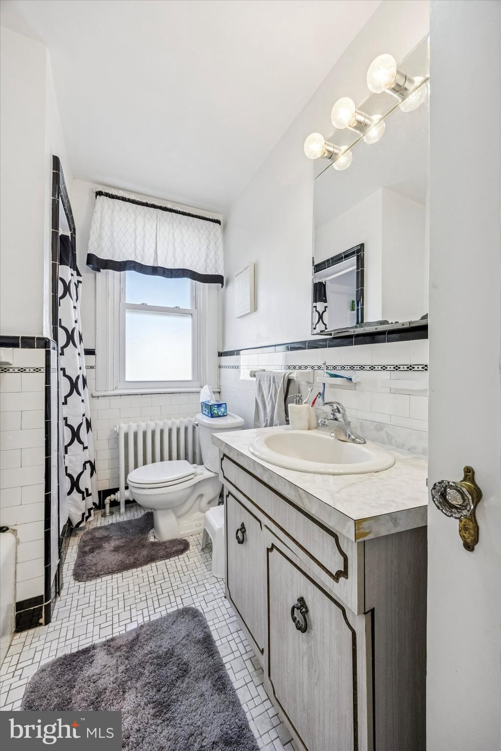 4032 Dayton Road Drexel Hill, PA 19026 - Photo 14 of 22 a bathroom with a sink vanity granite tub and a mirror