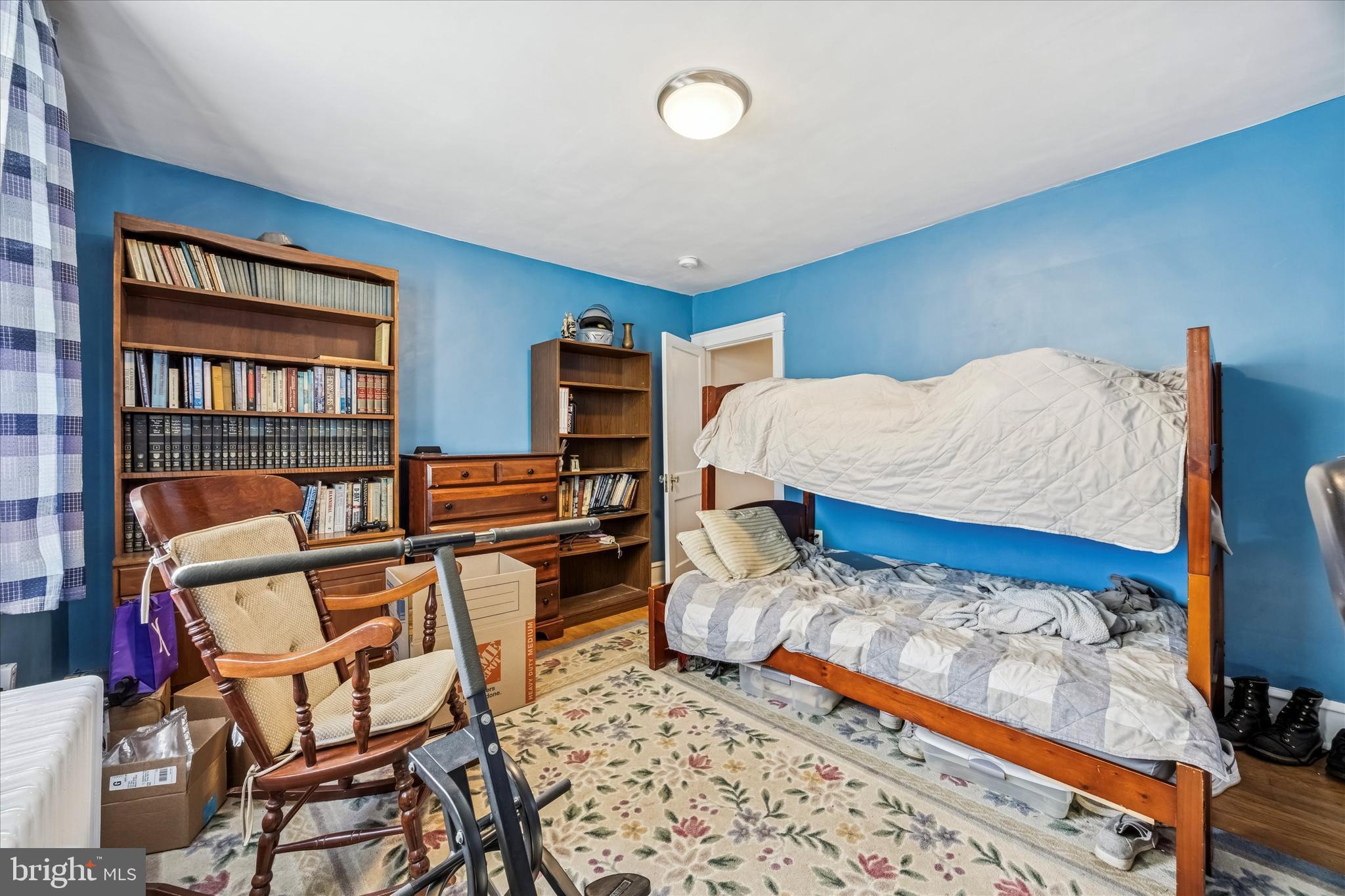 4032 Dayton Road Drexel Hill, PA 19026 - Photo 19 of 22 a bedroom with furniture and a book shelf
