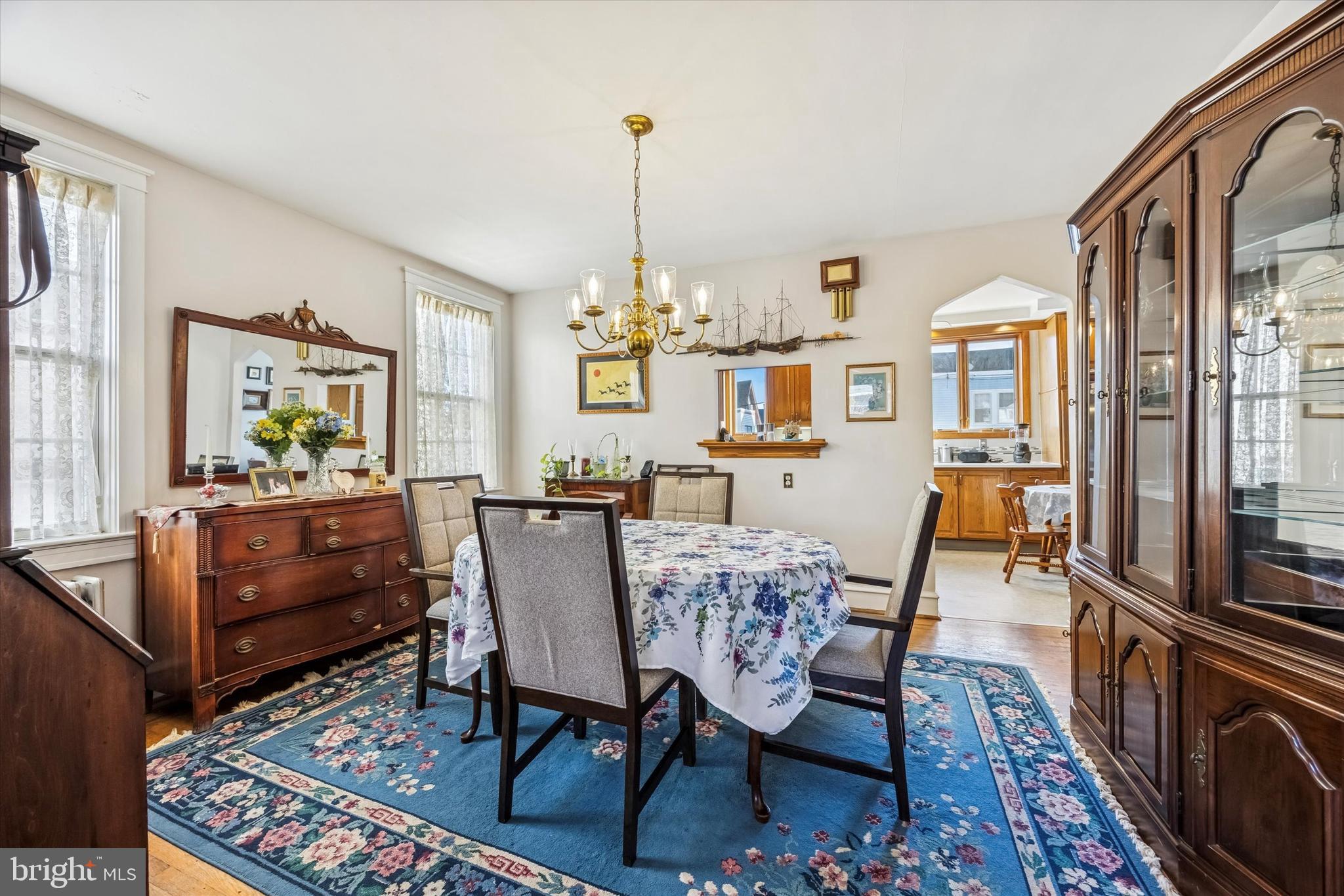 4032 Dayton Road Drexel Hill, PA 19026 - Photo 6 of 22 a dining room with furniture a chandelier and wooden floor