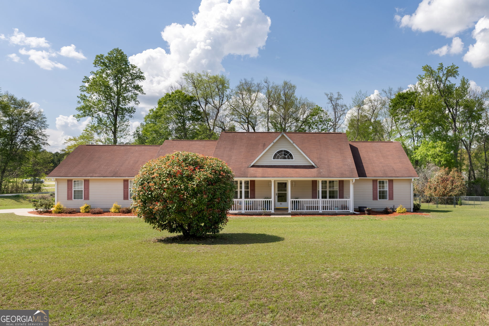 a front view of a house with garden
