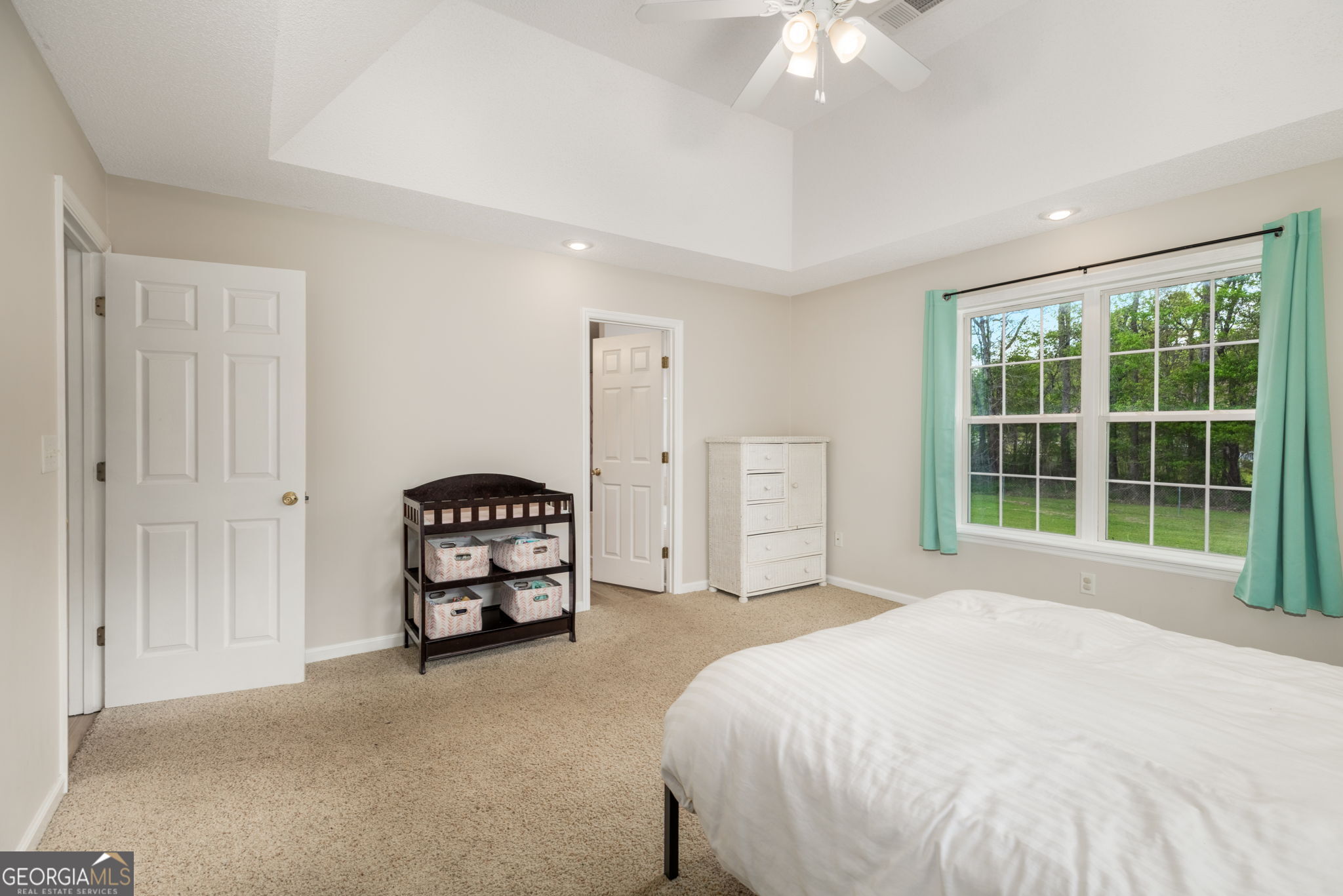 543 Pointe W Drive Dublin, GA 31021 - Photo 17 of 37 a bedroom with a bed and a chandelier