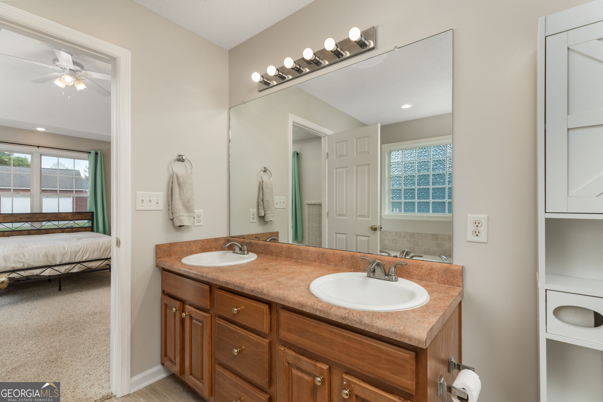 543 Pointe W Drive Dublin, GA 31021 - Photo 19 of 37 a bathroom with a sink double vanity and a mirror