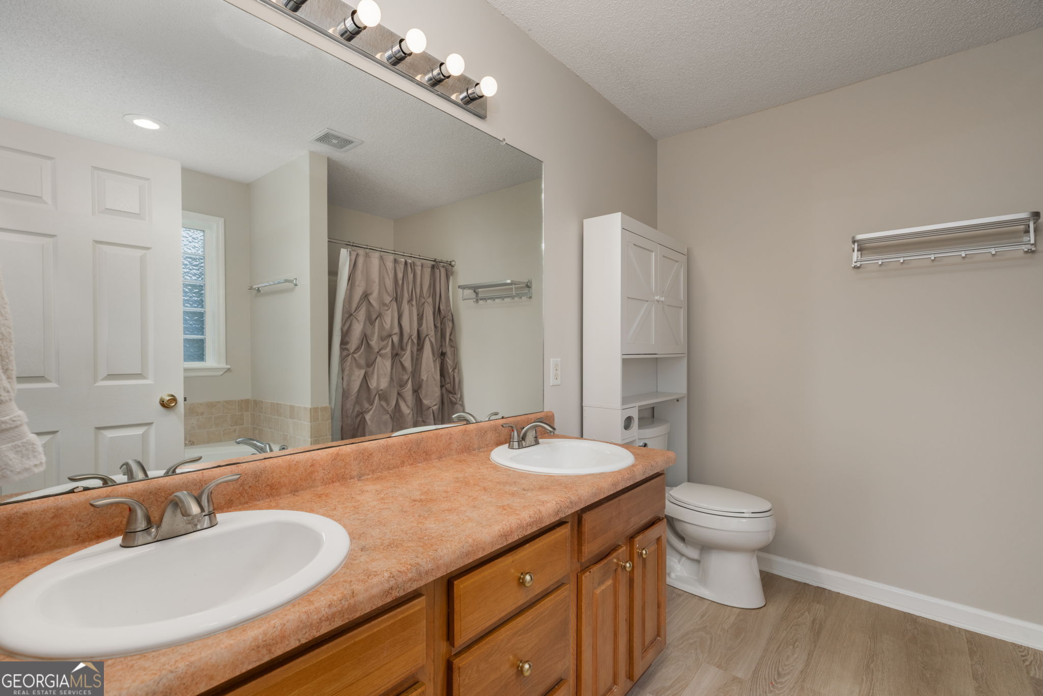 543 Pointe W Drive Dublin, GA 31021 - Photo 20 of 37 a bathroom with a granite countertop sink toilet and shower