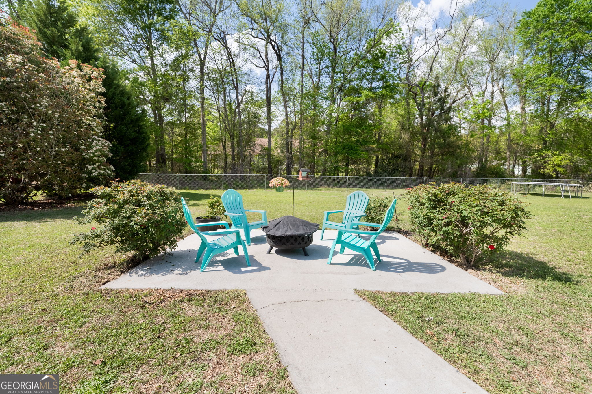 543 Pointe W Drive Dublin, GA 31021 - Photo 34 of 37 a view of a swimming pool with a patio and a garden