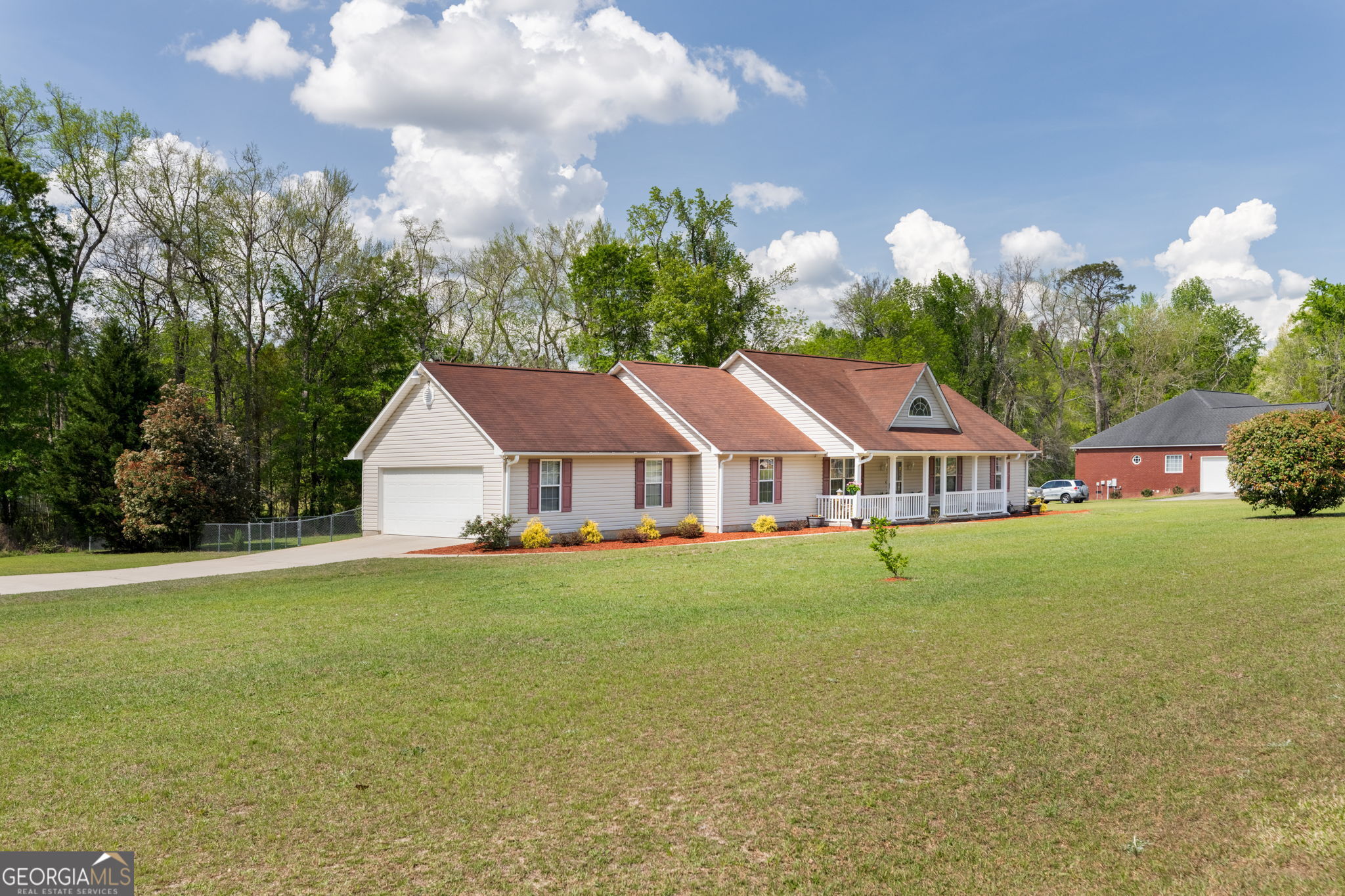 543 Pointe W Drive Dublin, GA 31021 - Photo 36 of 37 a view of a big house with a big yard plants and large trees