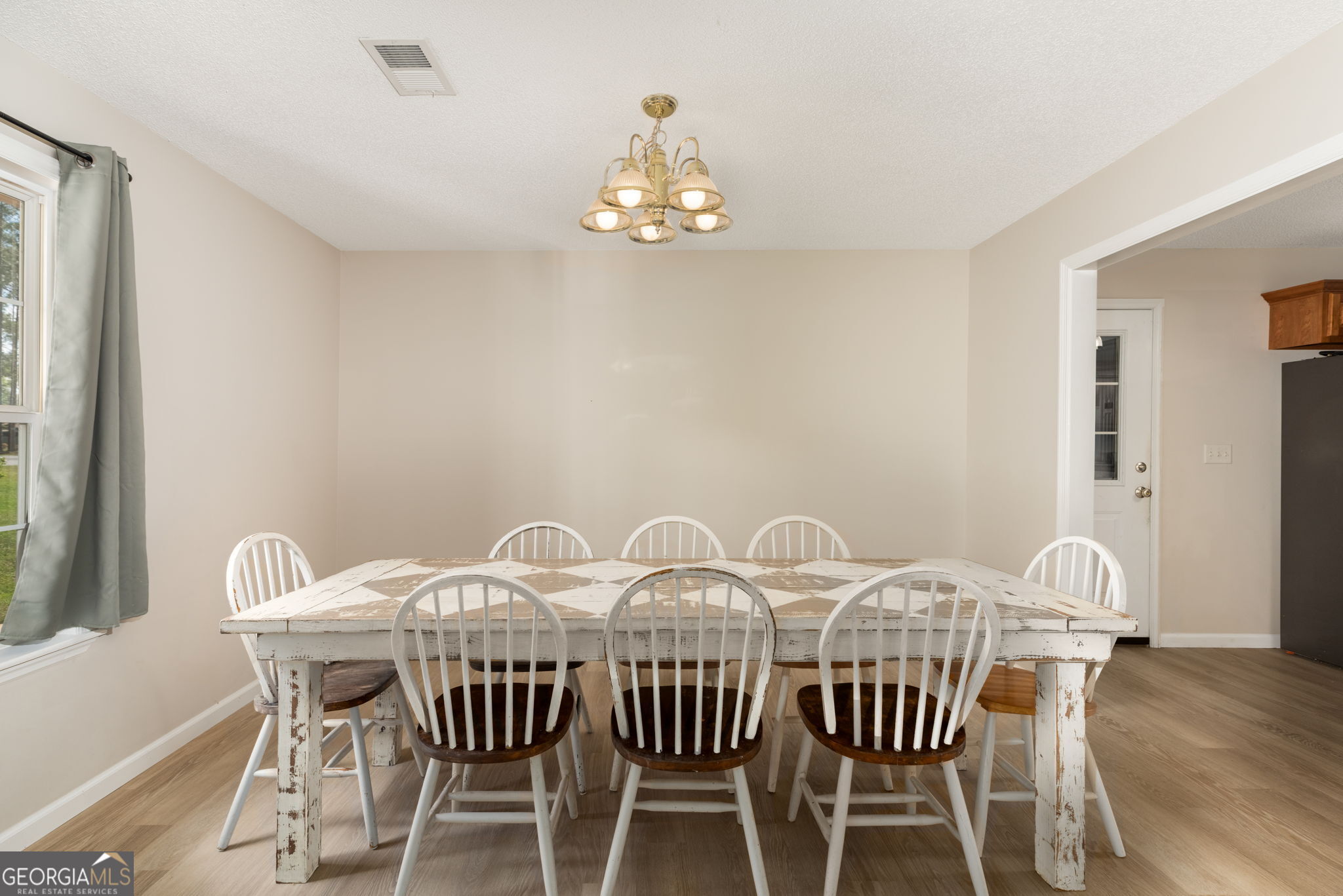 543 Pointe W Drive Dublin, GA 31021 - Photo 10 of 37 a view of a dining room with furniture window and wooden floor