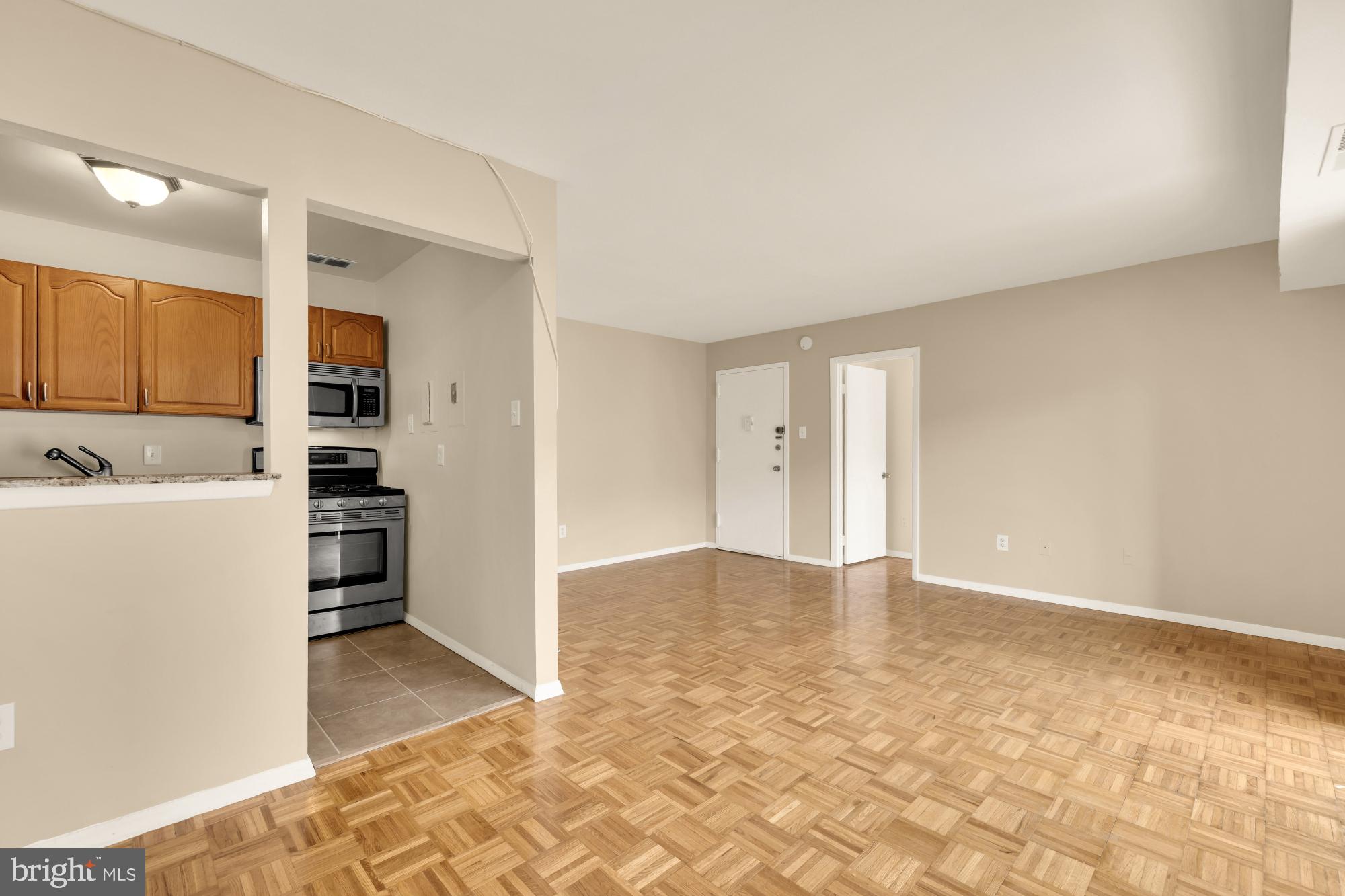7056 Eastern Avenue Northwest, Unit 107 Washington, DC 20012 - Photo 10 of 36 Large living room area!