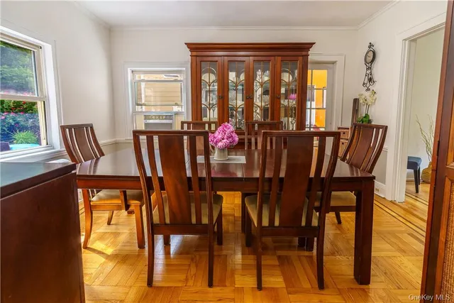 a view of a dining room with furniture and wooden floor
