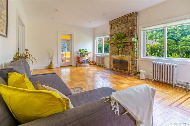 a living room with furniture and a floor to ceiling window