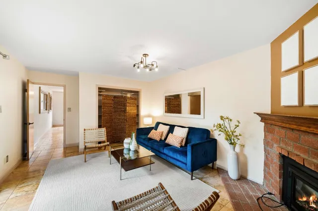 a view of a hallway with paintings on the wall