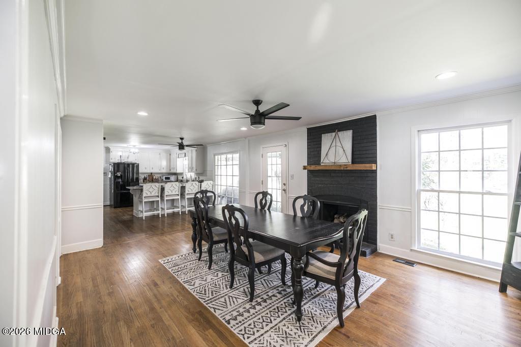 4759 Oxford Road Macon, GA 31210 - Photo 16 of 42 a view of a dining room with furniture and wooden floor